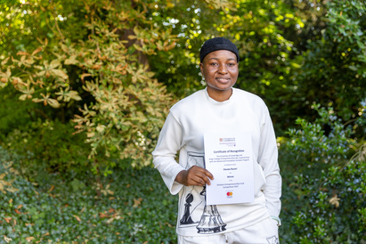 Competition winner Hauwa with certificate