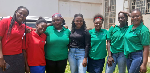 Mastercard Foundation Scholar Diana Amable with Tusome Africa's paraeducators 