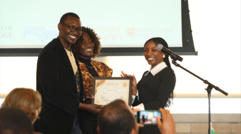 Mastercard Foundation Scholar Favour Peters receiving award cerificate 