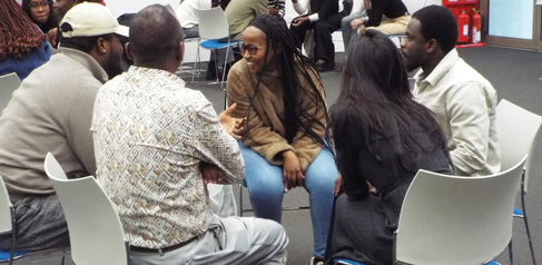 Mastercard Foundation Scholars in small group discussions on active listening