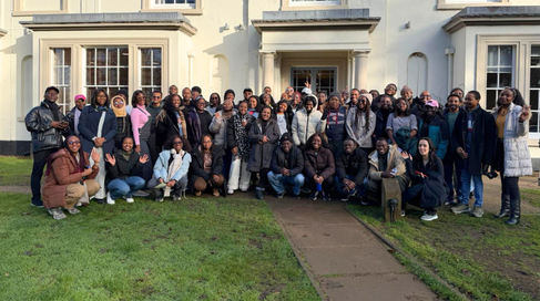 Group shot of Mastercard Foundation Scholars outside Stratford-Upon-Avon hostel