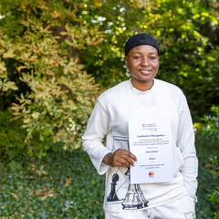 Competition winner Hauwa with certificate
