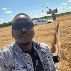 Mastercard Foundation Scholar Lagu Emmanuel Anthony at the Duxford NIAB trial grounds
